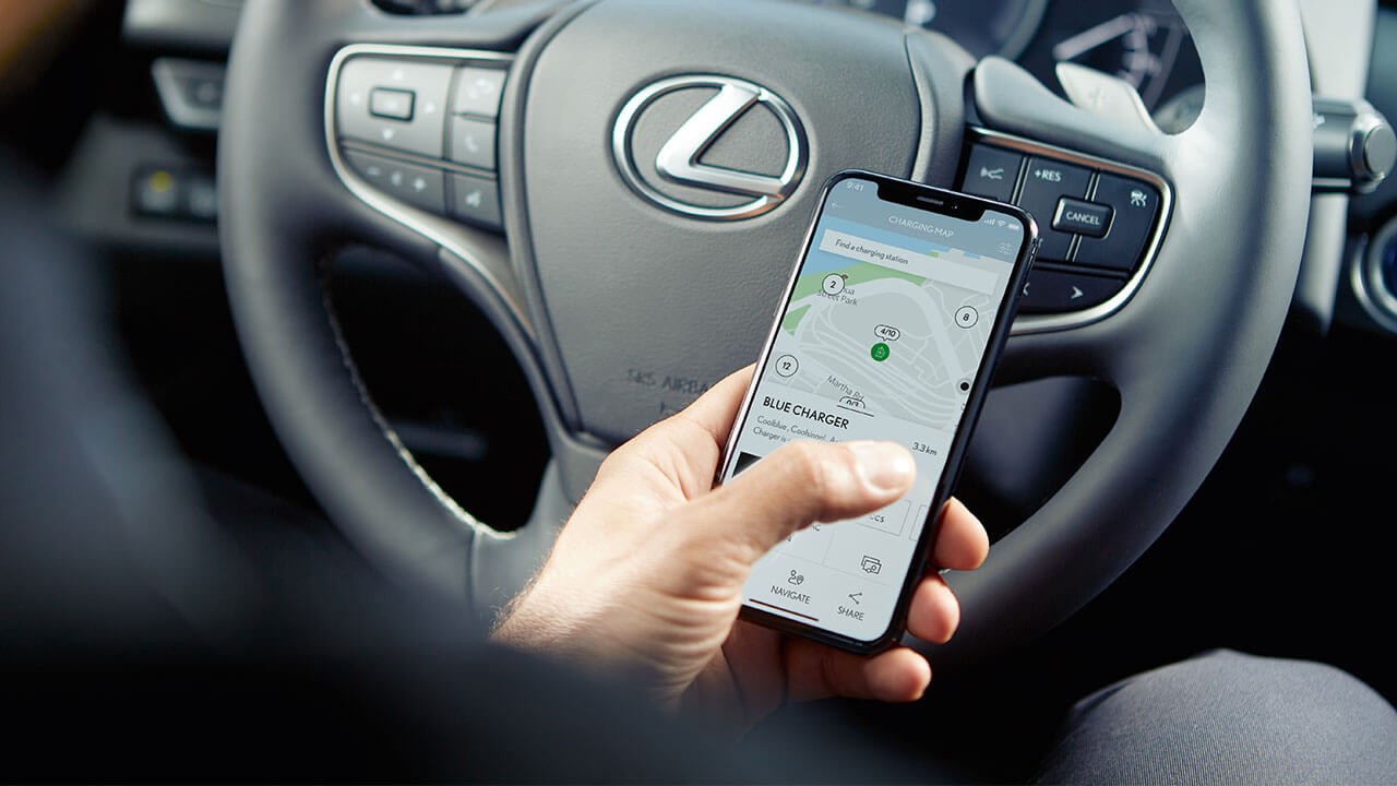 A man using a mobile phone to access the Lexus Link app