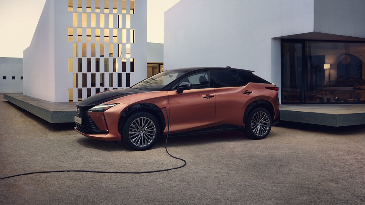 A Lexus UX 300e plugged into a charging port